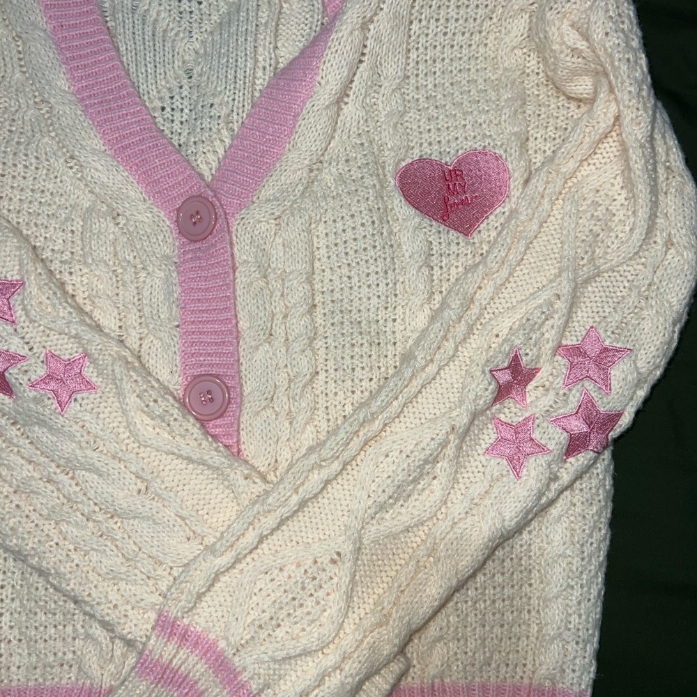 Cream Cable Knit Cardigan with Pink Trim and Star Appliqués